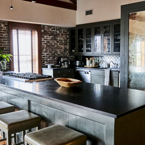 A modern, open-concept kitchen and dining area with wooden accents, sleek countertops, and ample natural light ending this sentence.